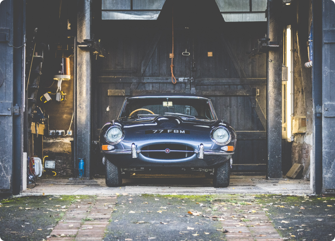 Jaguar parked in a garage